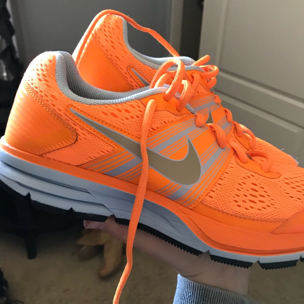 Neon orange Nike shoes
